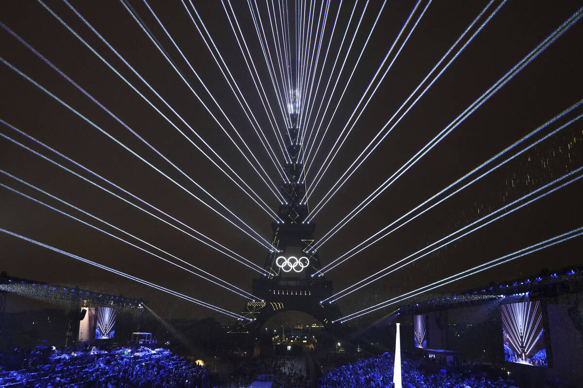 Lights illuminate the Eiffel Tower, in Paris, France, during the opening ceremony of the 2024 ...
