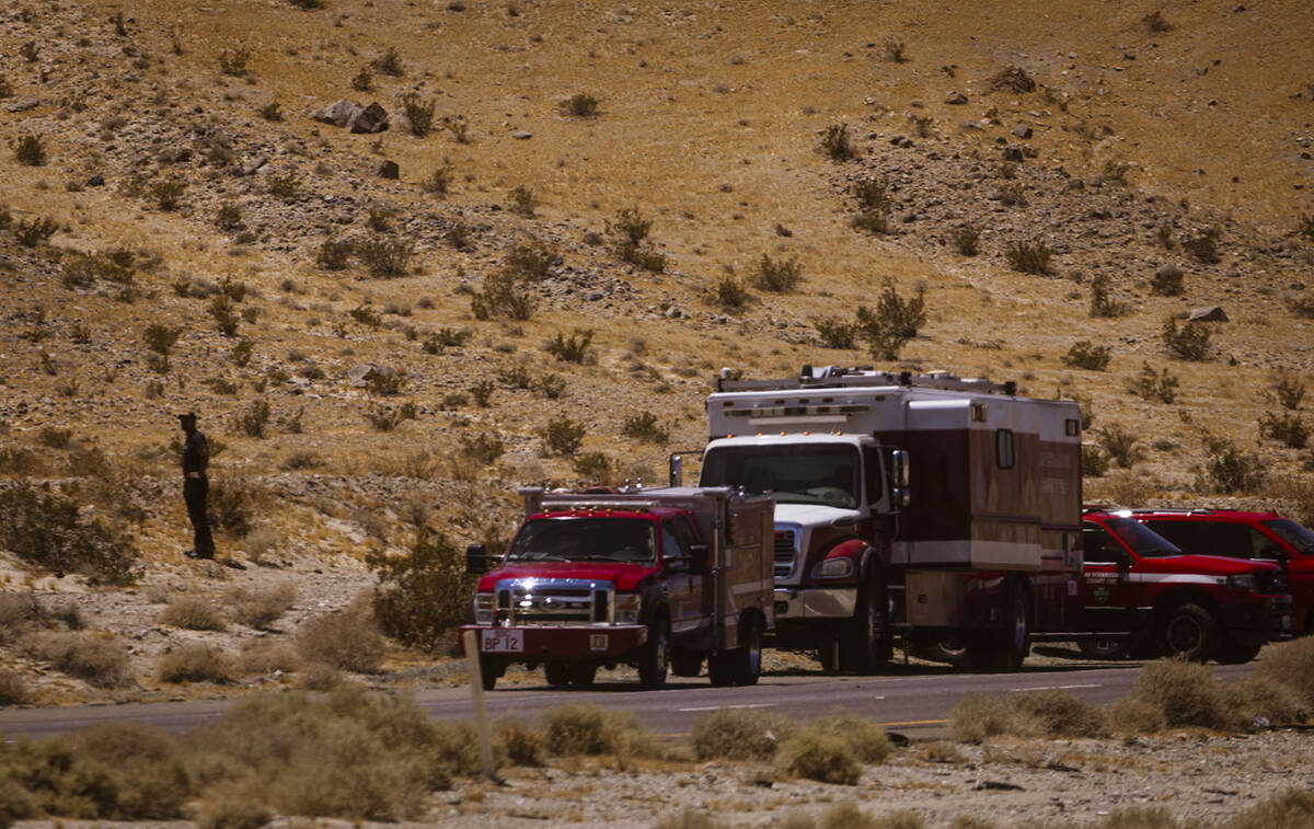 Law enforcement agencies vehicles are seen gathered by the scene of an overturned truck fire ca ...