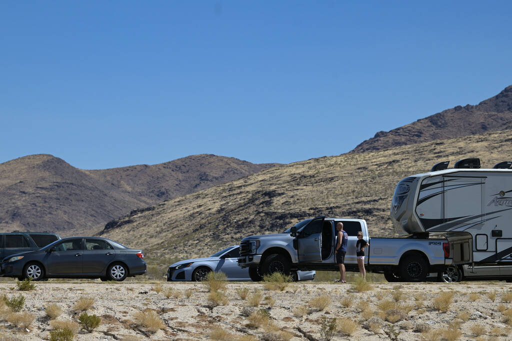 A couple gets out of their vehicle while being stuck in traffic on eastbound I-40 west of Essex ...