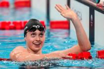 Claire Weinstein, of the United States, reacts after competing in the women's 200-meter freesty ...