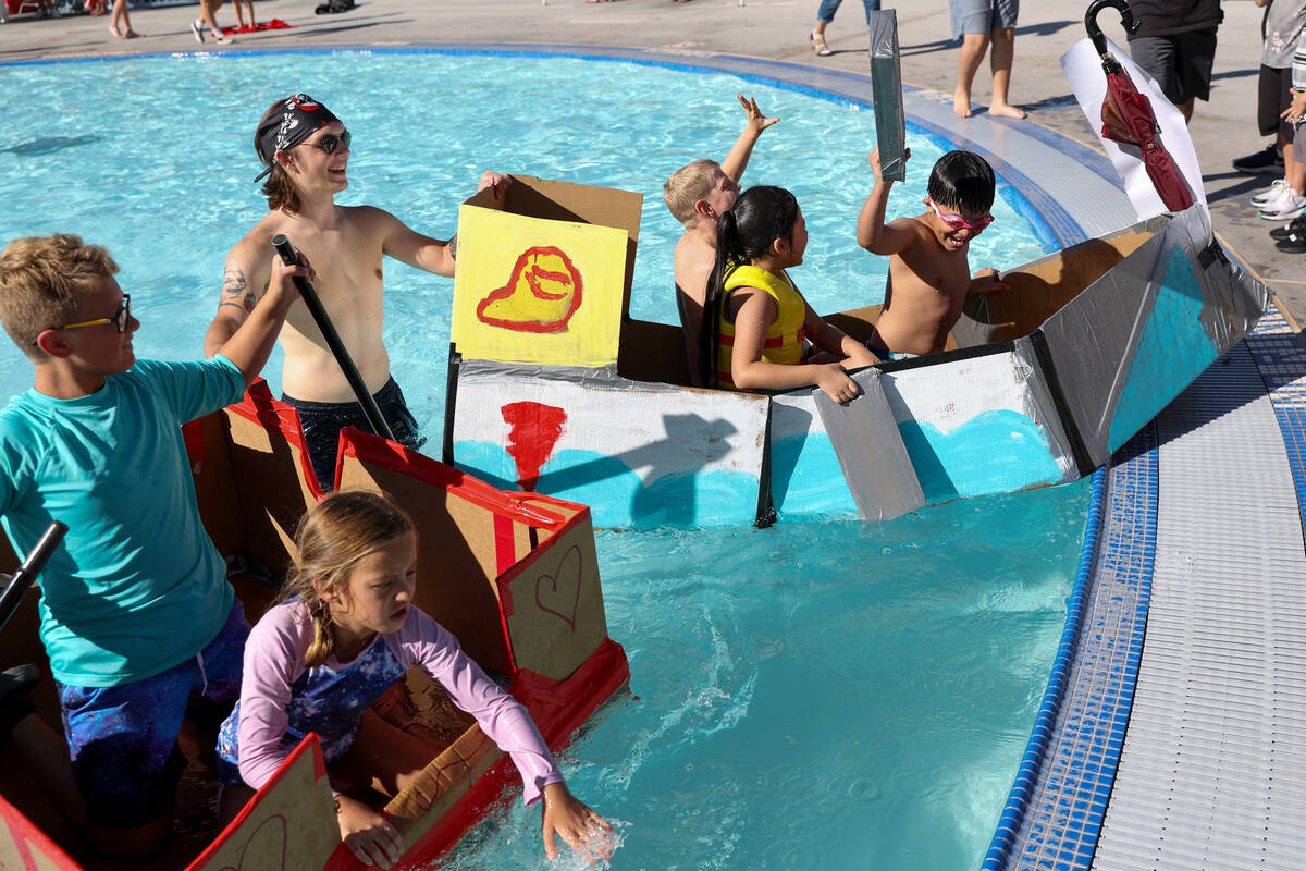 Adrien Moncada, 11, Ari Moncada, 7, and Josiah Vivanco, 8, in the right boat, win their race du ...