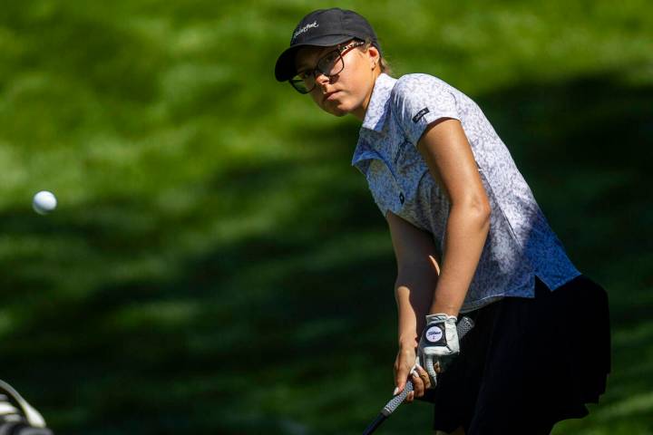 McKenzi Hall of UNLV chips the ball from the 13th rough onto the green during the first day of ...