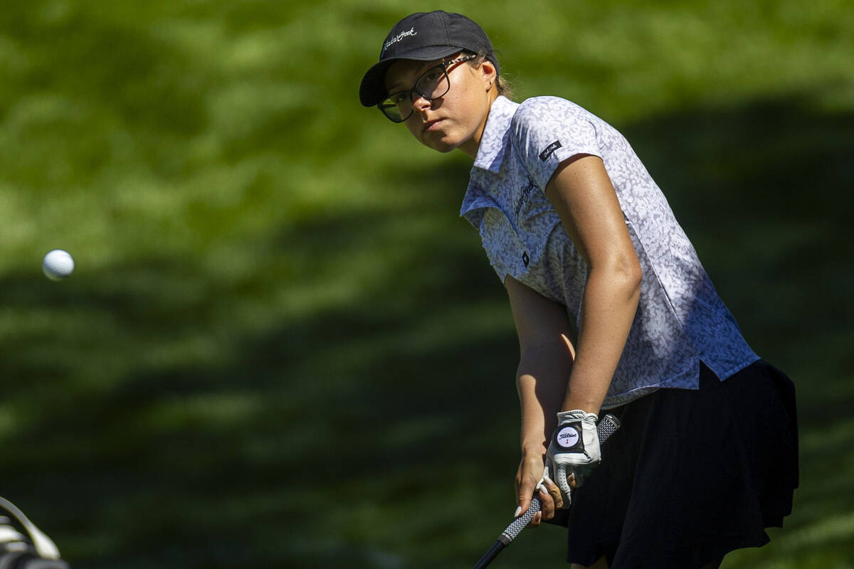 McKenzi Hall of UNLV chips the ball from the 13th rough onto the green during the first day of ...