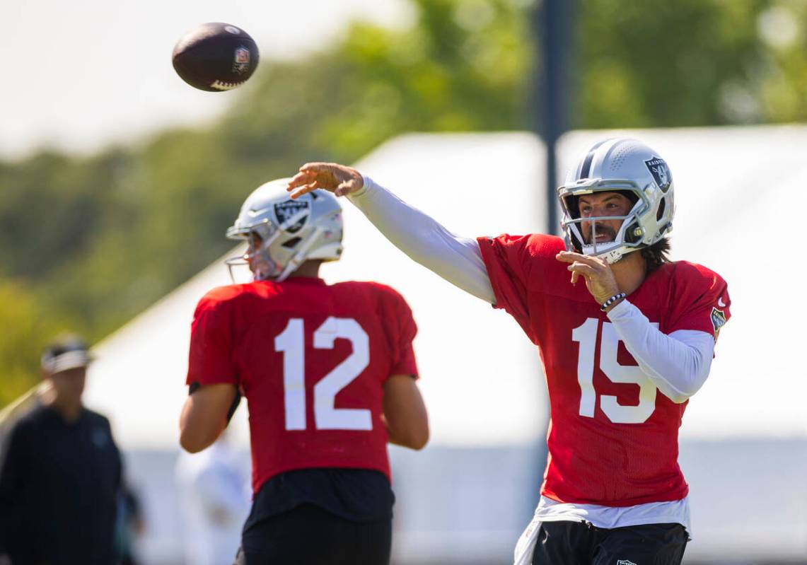 Raiders quarterback Gardner Minshew (15) gets off a pass during the third day of Raiders traini ...