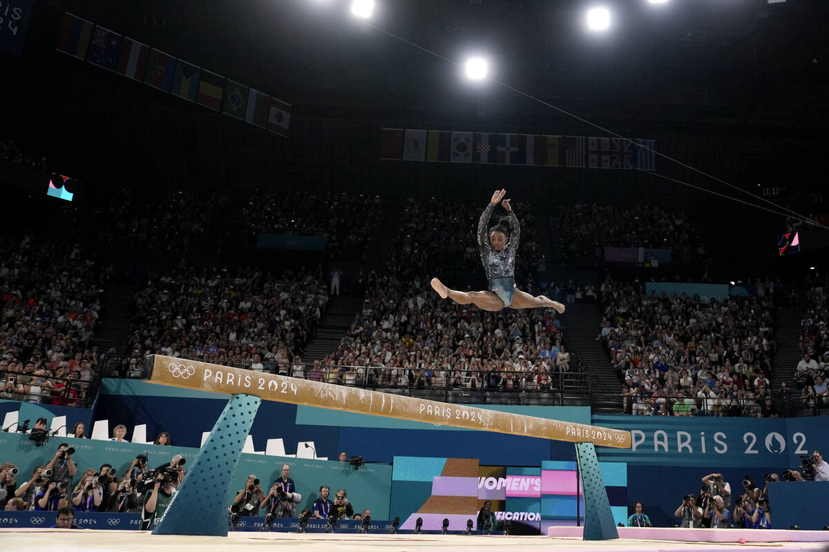 Simone Biles of the United States competes on the balance beam during a women's artistic gymnas ...