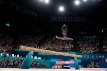 Simone Biles of the United States competes on the balance beam during a women's artistic gymnas ...