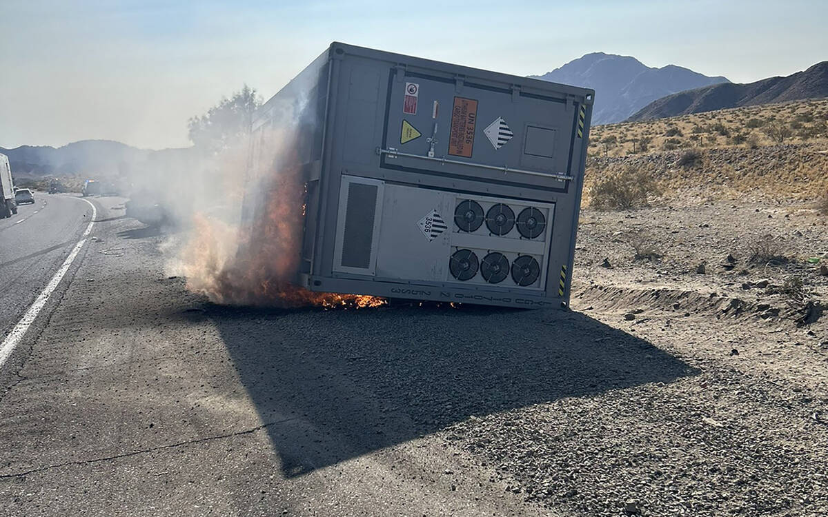 A 30-foot container, which was carrying lithium ion batteries, sits on the side of the road on ...