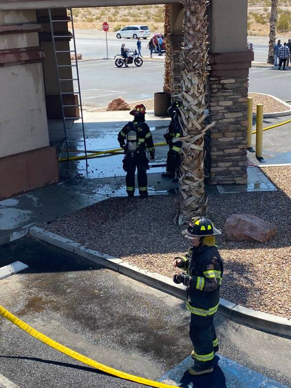 Member of the Pahrump Valley Fire and Rescue extinguishing a fire at the Pahrump DMV office on ...