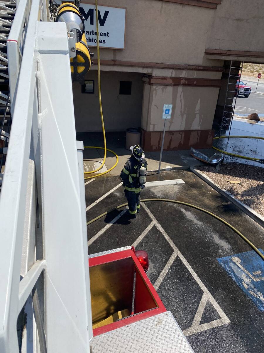 Member of the Pahrump Valley Fire and Rescue extinguishing a fire at the Pahrump DMV office on ...