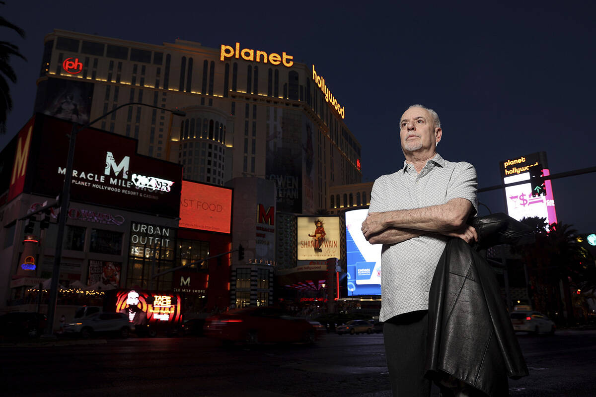 FILE - Jeff German, host of "Mobbed Up," poses with Planet Hollywood, formerly the Aladdin, in ...