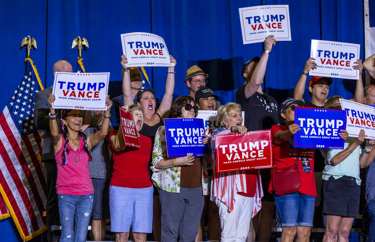 Supporters cheer as they stand behind Ohio Senator JD Vance delivering remarks during a rally a ...