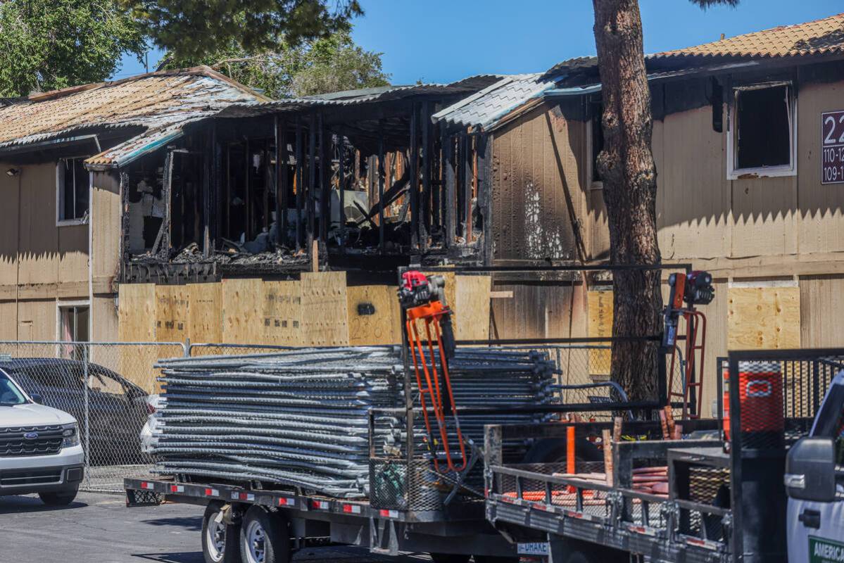 The remnants of the burned apartment complex where one person was killed and four were injured ...