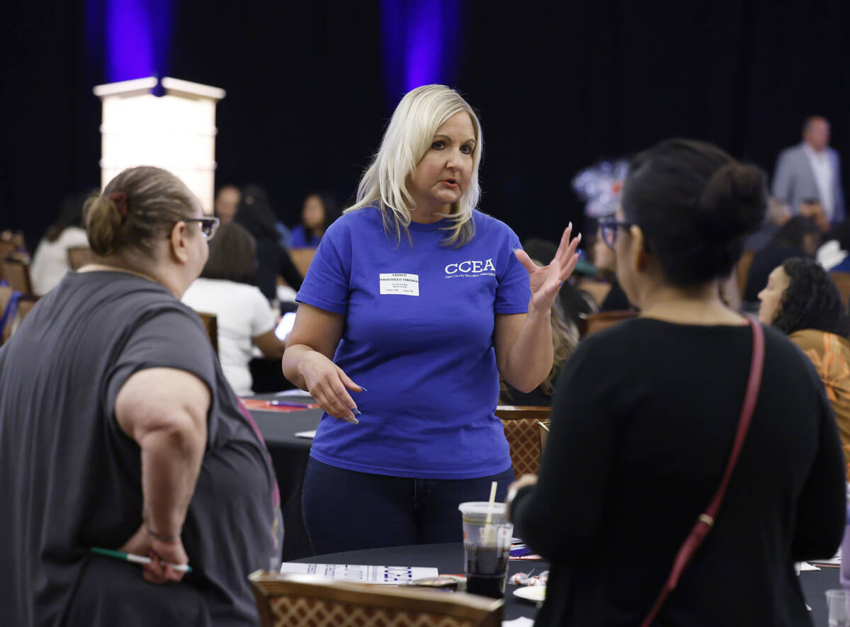 Lauren A Hermosillo Magallanes, center, a social worker at Arbor View High School, speaks to ne ...