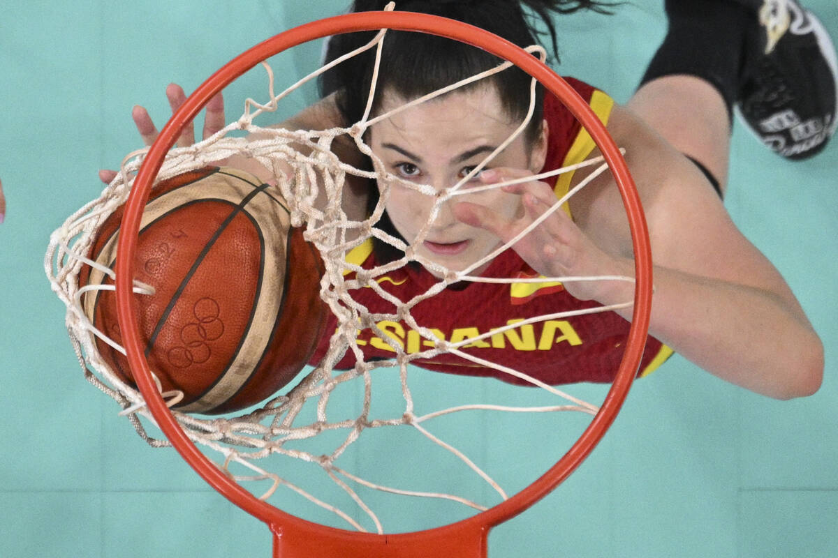 Megan Gustafson, of Spain, watches her shot fall through the basket in a games against Puerto R ...