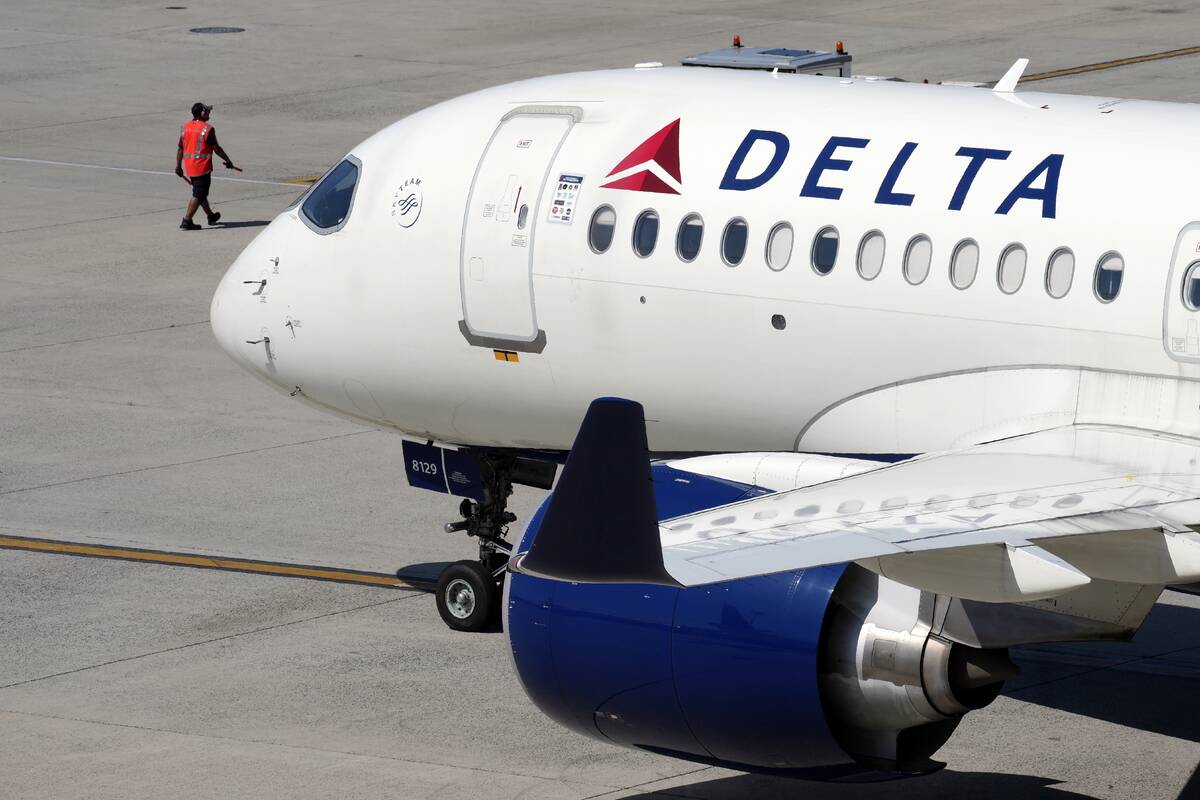 A Delta Air Lines jet leaves the gate, July 19, 2024, at Logan International Airport in Boston. ...