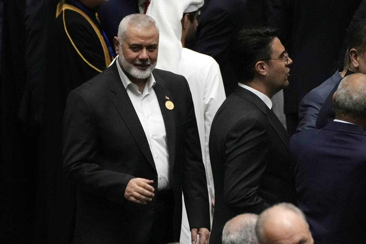 Hamas chief Ismail Haniyeh arrives at the Iranian parliament to attend the swearing-in ceremony ...