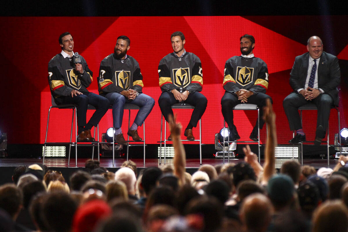 Vegas Golden Knights' Marc-Andre Fleury, left, speaks alongside fellow players Deryk Engelland, ...