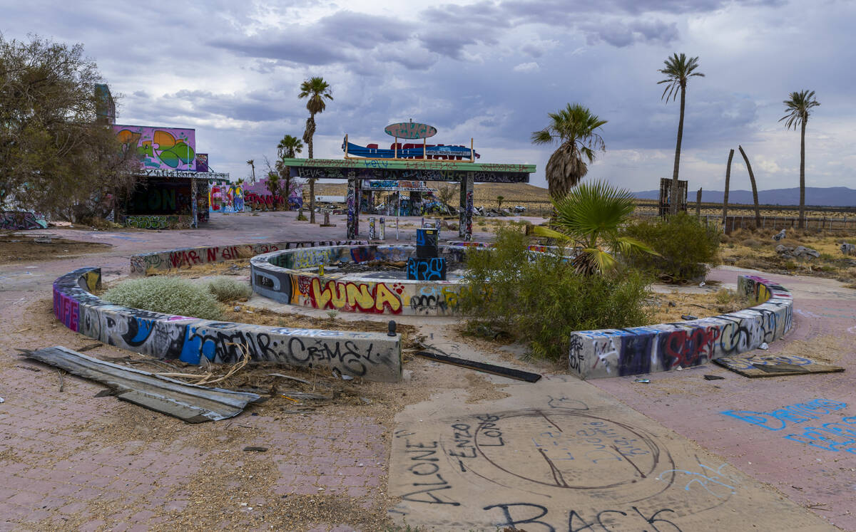 Graffiti covers most of the remaining structures at the former Rock-A-Hoola Water Park on Tuesd ...