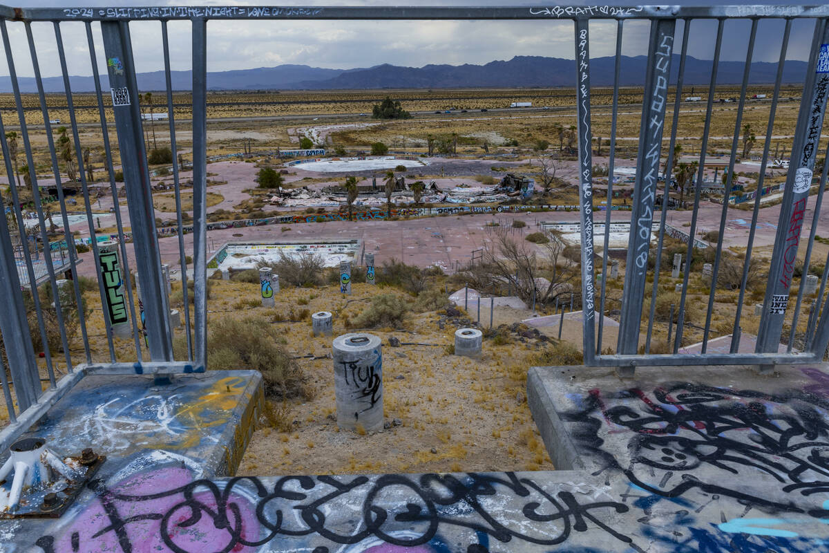 A water slide hill is dismantled and covered in graffiti at the former Rock-A-Hoola Water Park ...