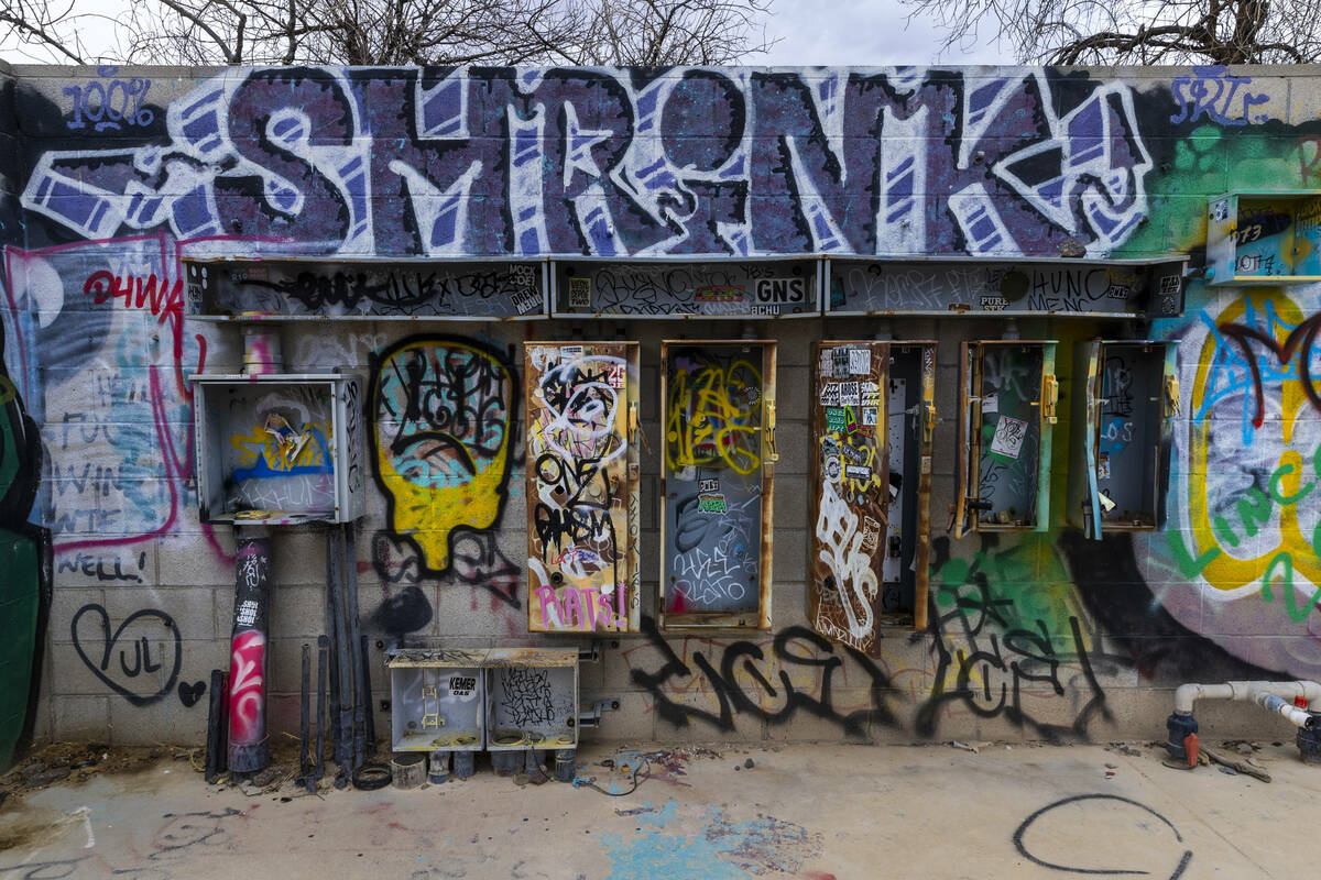 Graffiti covers most of the remaining structures at the former Rock-A-Hoola Water Park on Tuesd ...