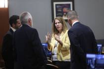 Chief Deputy District Attorney Pamela Weckerly, center, speaks with Metropolitan Police Departm ...