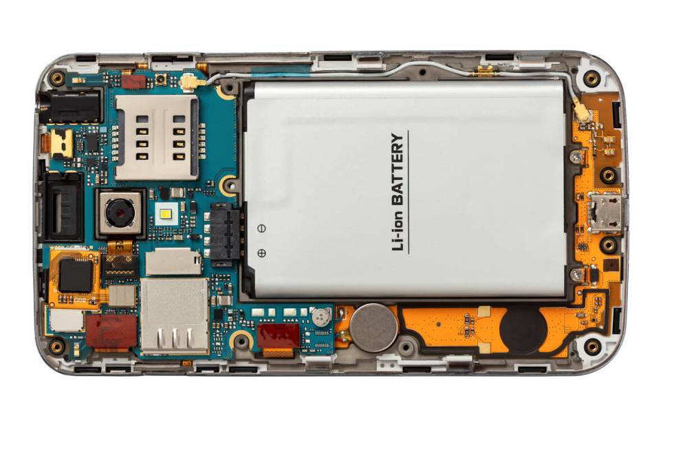 A disassembled mobile phone shows an lithium-ion battery inside. (Getty Images)