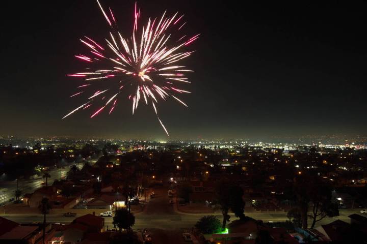 Fireworks explode over a neighborhood on the east side of Las Vegas Thursday, July 4, 2024. (Sa ...