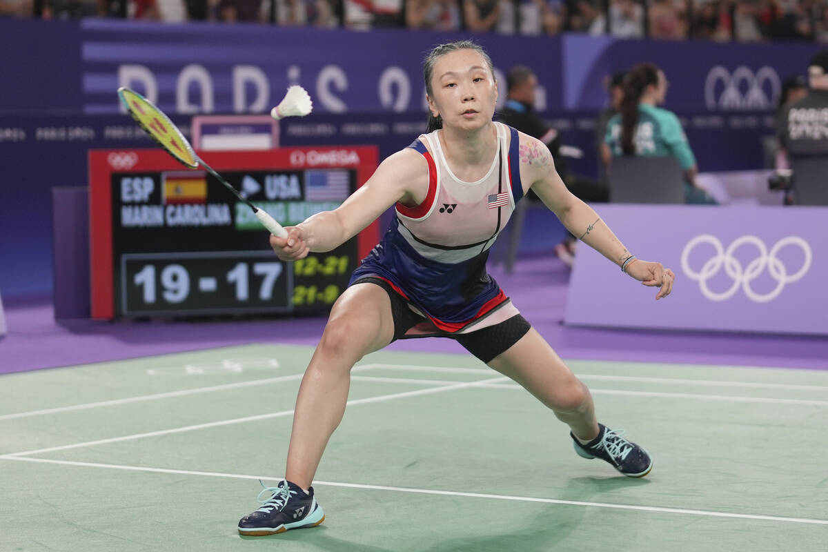 United States' Beiwen Zhang plays against Spain's Carolina Marin during their women's singles b ...