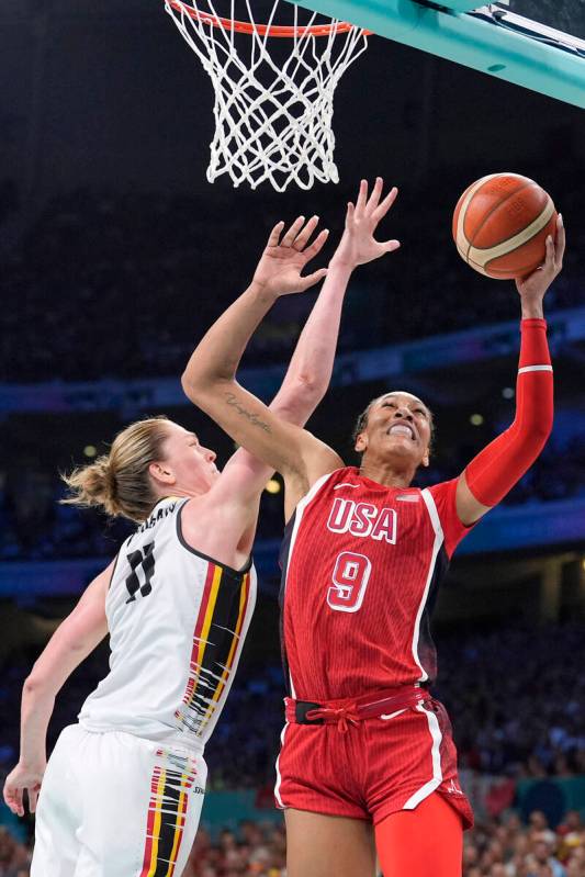 United States' A'ja Wilson, right, shoots as Belgium's Emma Meesseman defends during a women's ...