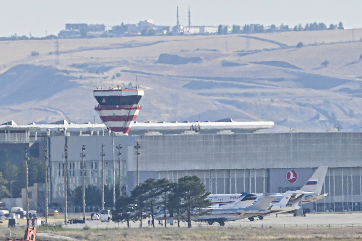 Planes believed to be carrying prisoners coming from Russia upon their arrival at the Ankara Ai ...