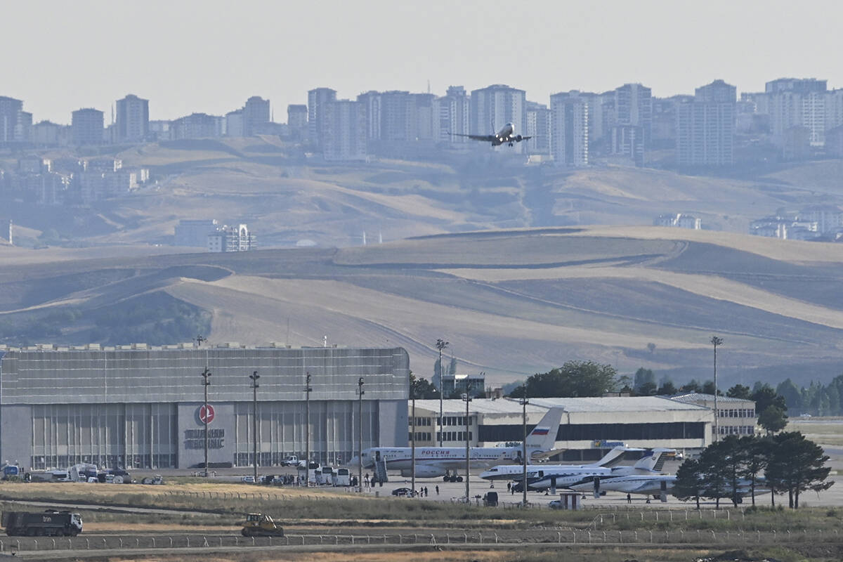 Planes believed to be carrying prisoners coming from Russia upon their arrival at the Ankara Ai ...