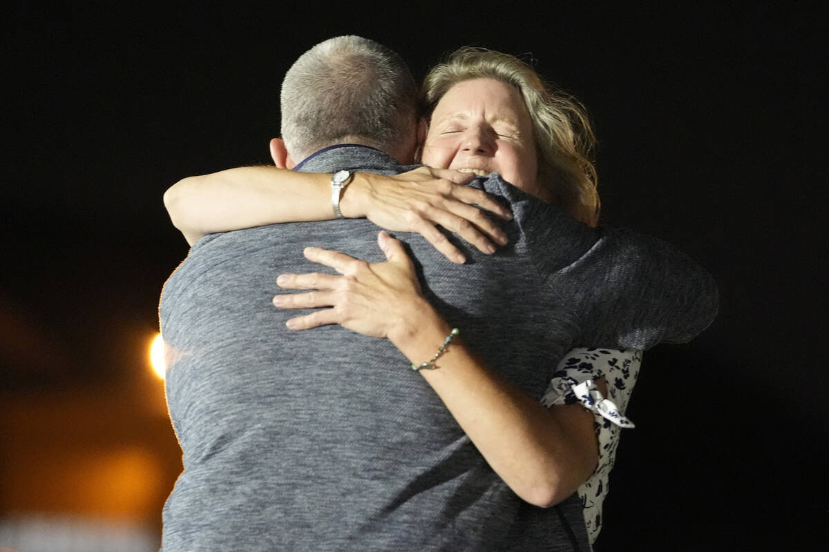 Elizabeth Whelan, right, hugs her brother Paul Whelan at Andrews Air Force Base, Md., following ...