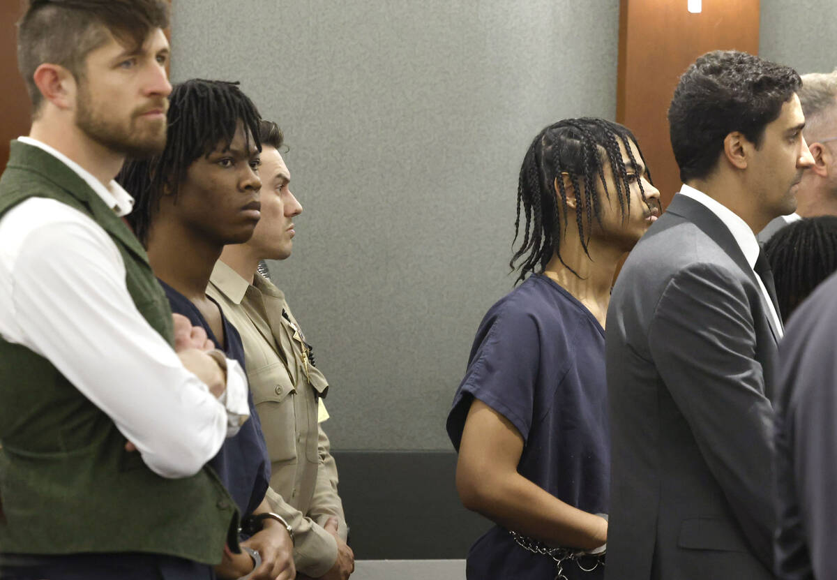 Dontral Beaver, second left, and Treavion Randolph, second right, appear in court during a pret ...