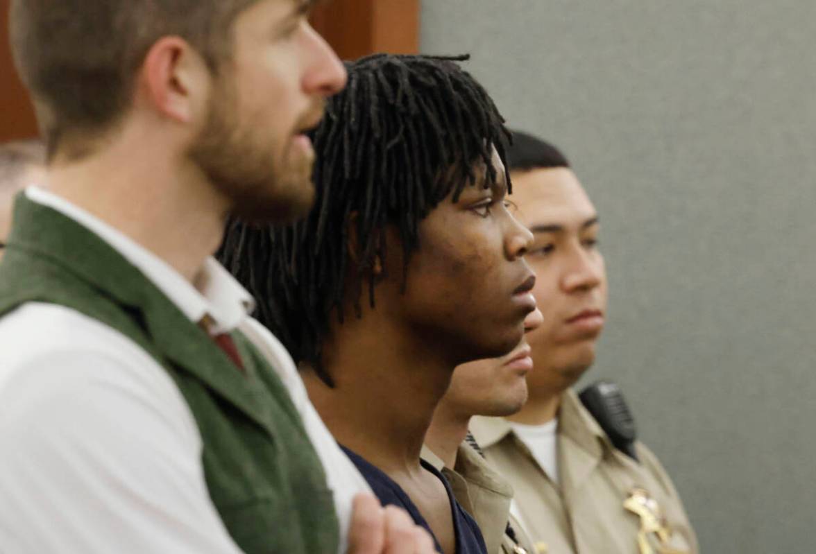 Dontral Beaver, center, appears in court during a pretrial conference at the Regional Justice C ...