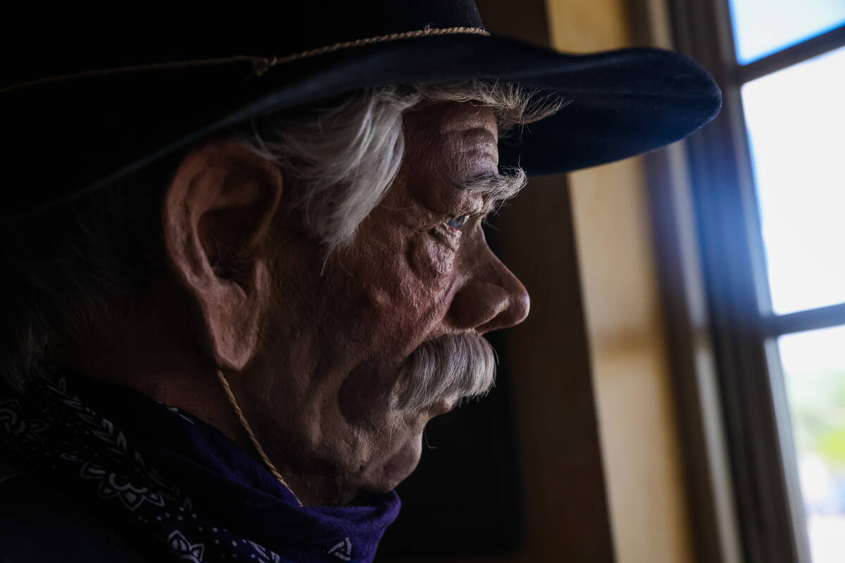 A mannequin dressed like a cowboy faces the window inside of The Palace during Goldfield Days o ...