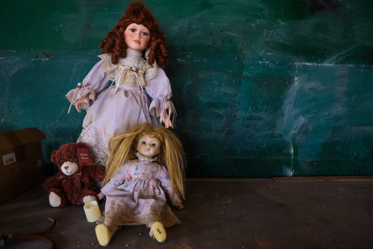 Old dolls sit inside of Goldfield High School during Goldfield Days on Saturday, Aug. 3, 2024, ...