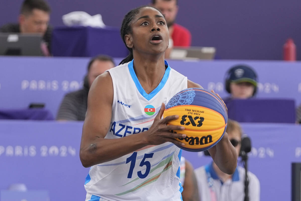 Azerbaijan's Tiffany Hayes (15) shoots the ball in the women's 3x3 basketball pool round match ...