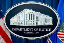 The U.S. Justice Department sign is seen, Nov. 18, 2022, in Washington. A Henderson resident ha ...