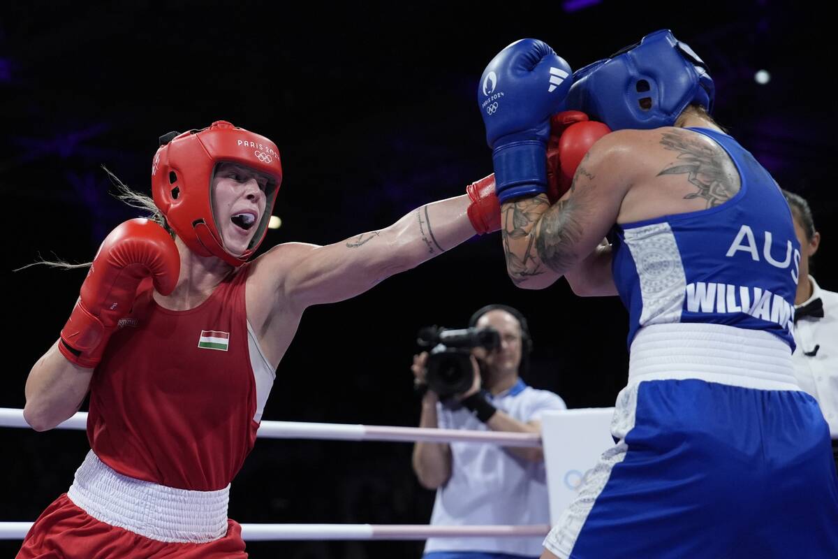 Hungary's Anna Hamori, left, fights Australia's Marissa Williamson in their women's 66kg prelim ...