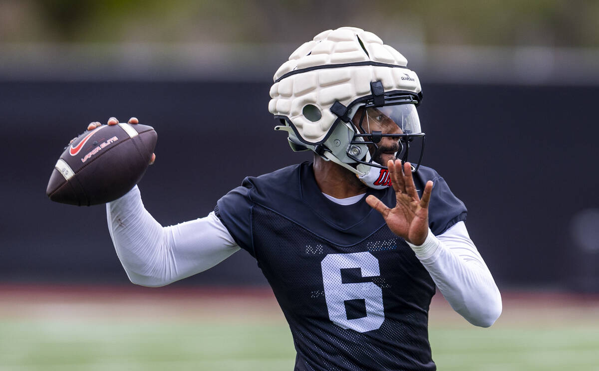 UNLV quarterback Hajj-Malik Williams (6) looks for a receiver during the first day of football ...