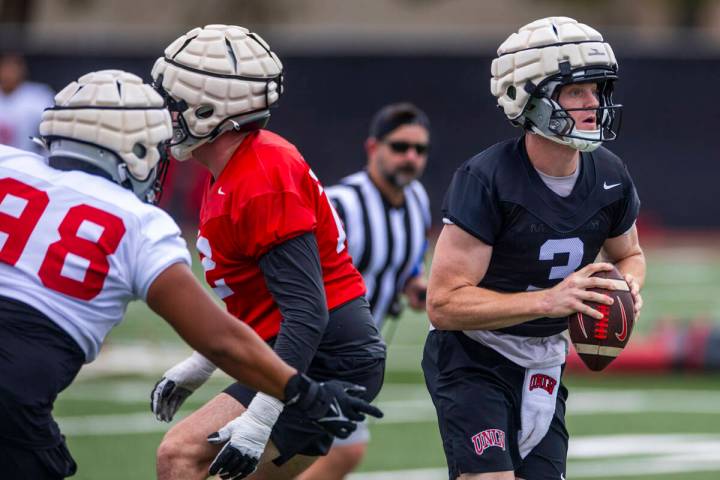 UNLV quarterback Matthew Sluka (3) looks for a receiver as he moves up in the pocket during the ...