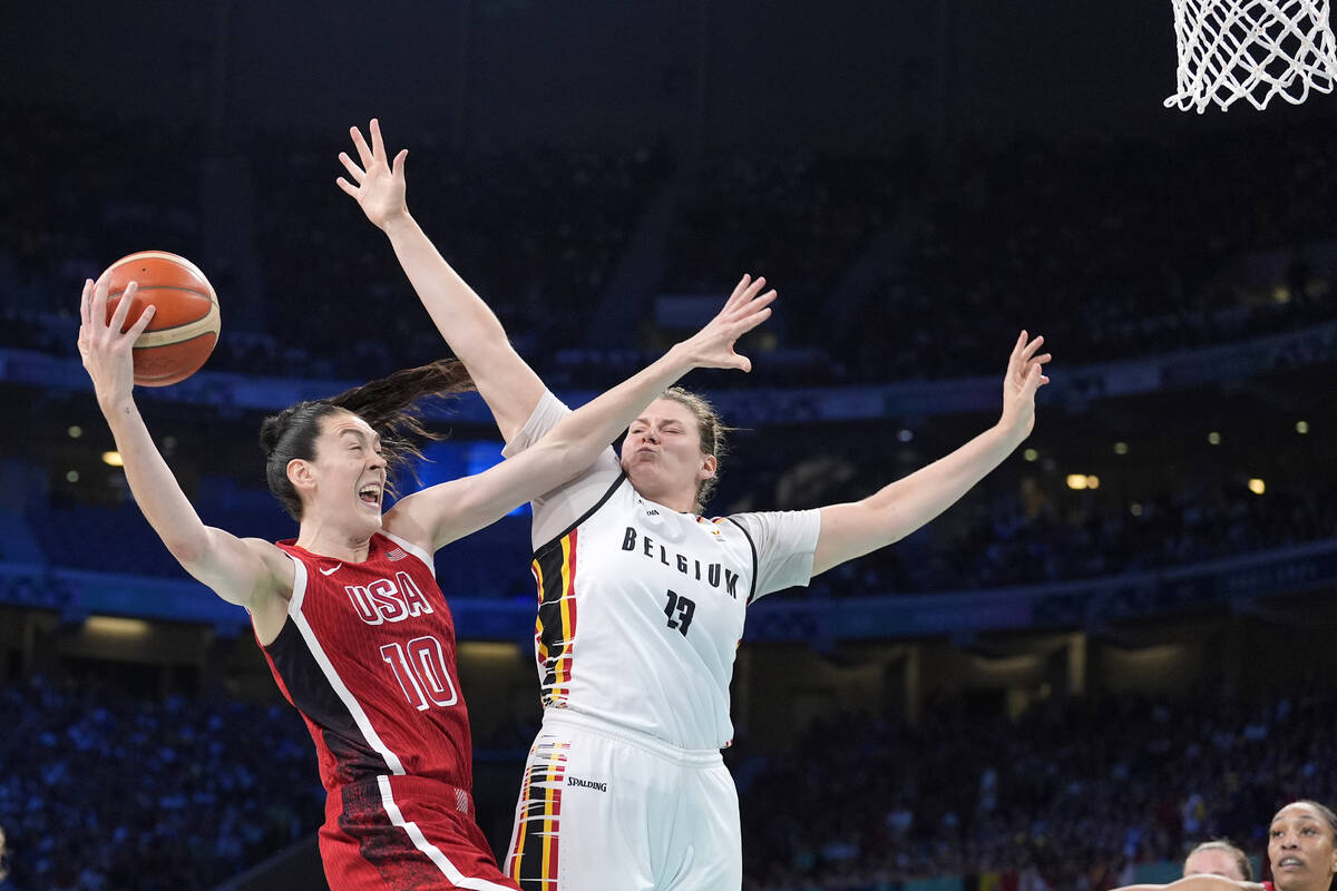 United States' Breanna Stewart, left, shoots as Belgium's Kyara Linskens defends during a women ...