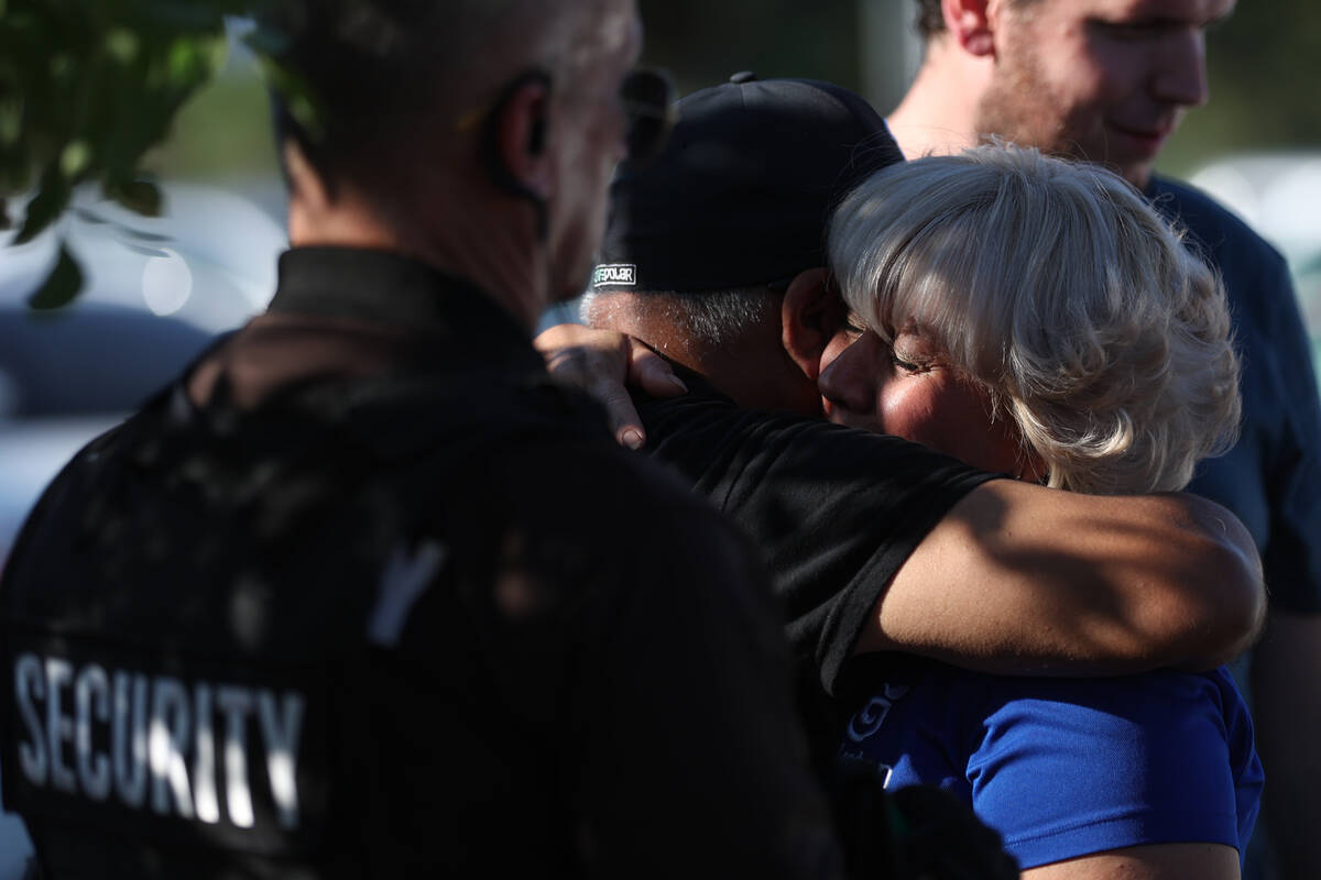 Luby Grunden, right, a spokesperson for the family of Alexander Maceo-Sanabria, is comforted af ...