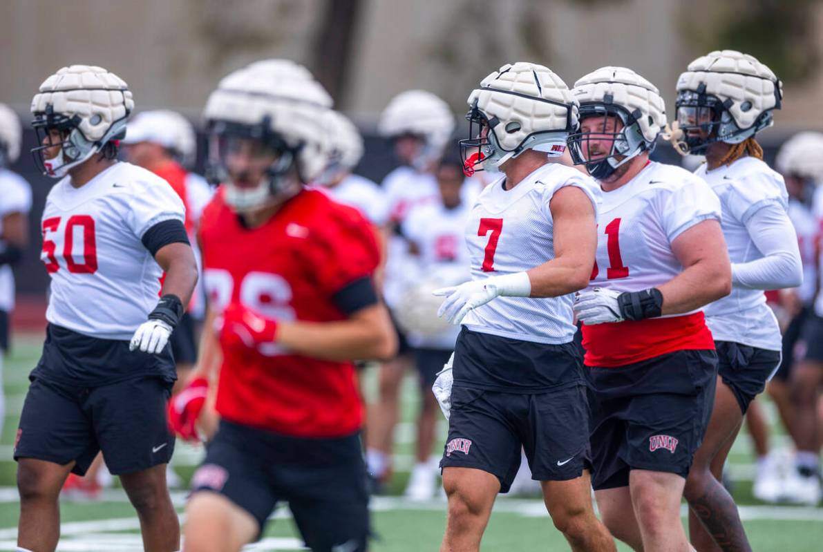 UNLV linebacker Jackson Woodard (7) runs to a drill with teammates during the first day of foot ...