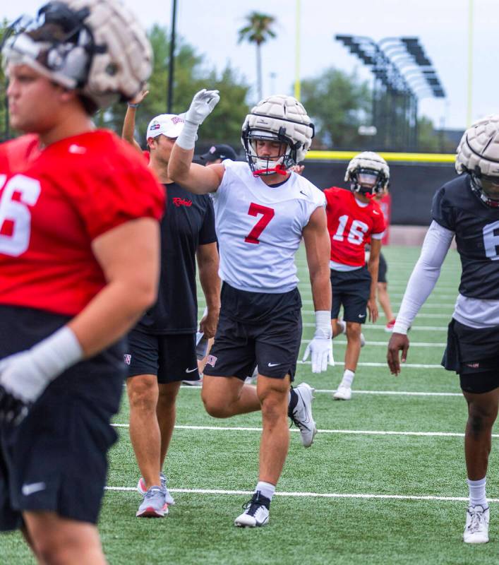 UNLV linebacker Jackson Woodard (7) warms up with teammates during the first day of football pr ...