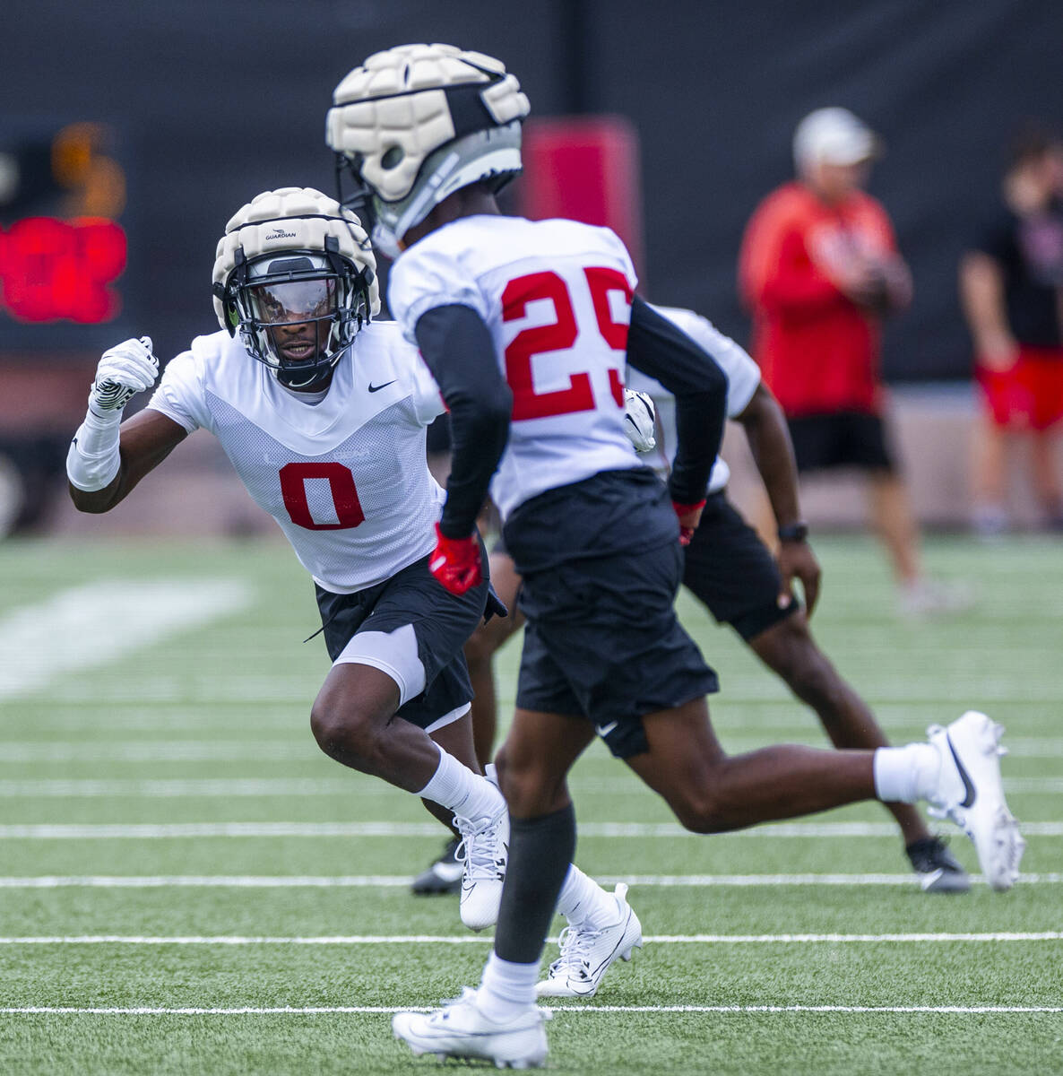 UNLV defensive back Tony Grimes (0) closes in on defensive back Jaylen Allen (25) on a drill du ...