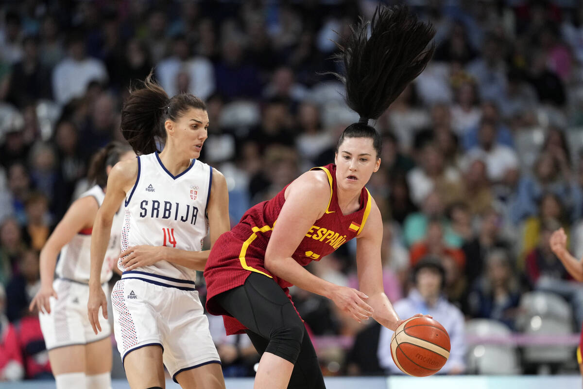 Spain's Megan Gustafson, right, dribbles while under pressure from Serbia's Dragana Stankovic d ...