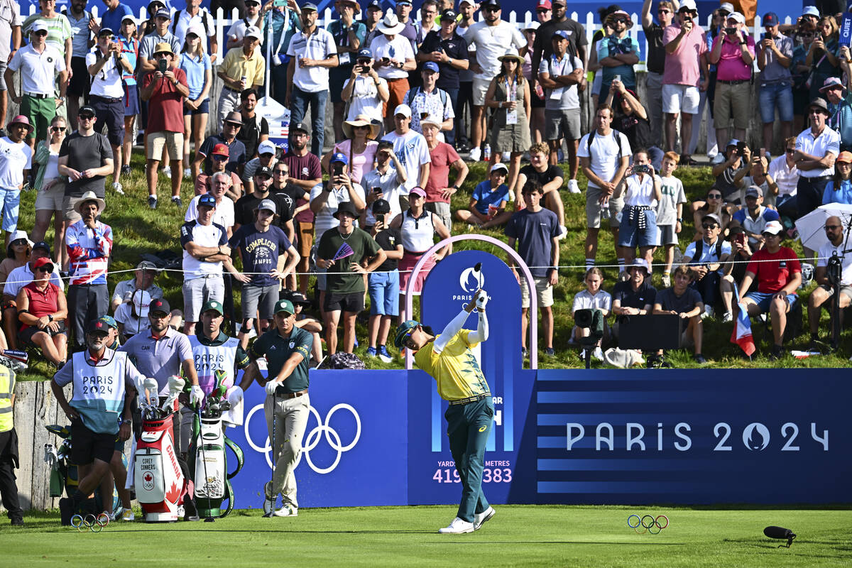 Min Woo Lee of Team Australia tees off on the first hole during the first round of the 2024 Pa ...