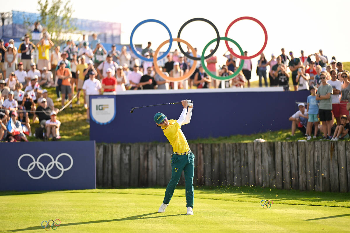 Min Woo Lee of Team Australia tees off on the first hole during the first round of the 2024 Pa ...