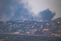 Smoke rises after a strike in an area in Lebanon next to the Israeli-Lebanese border at the Gal ...